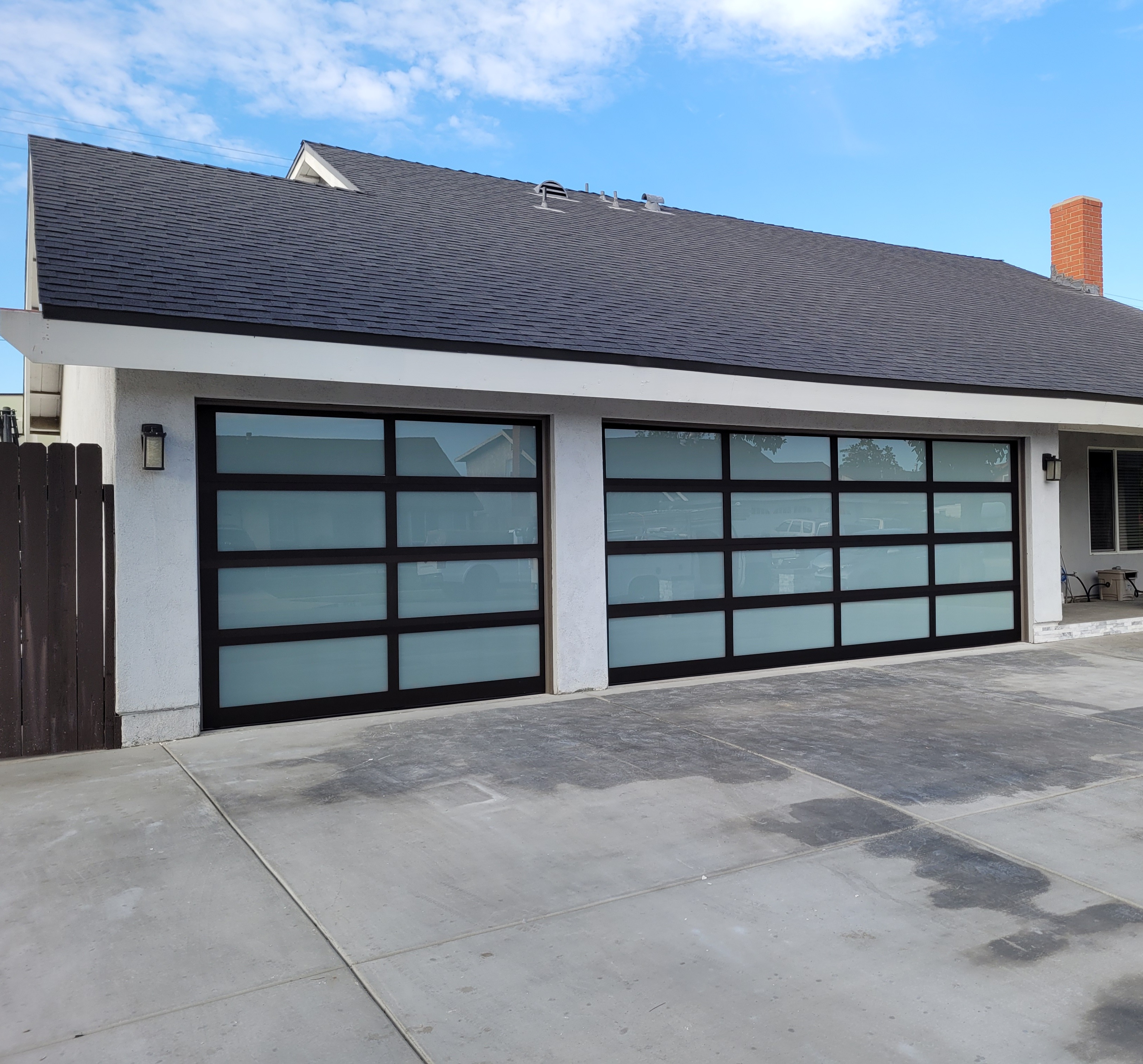 Sunlit residential garage with glass-panel door in Southern California